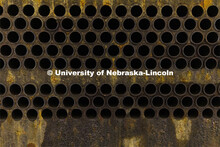 Hundreds of tubes used to exchange heat in a chiller await cleaning. City Campus utility plant. Nove