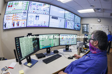 Cody Kinning, an operator with utility services, monitors the city campus power plant using the scre
