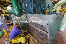 Dwayne Mischnick, a plumber/pipefitter with utility services, cleans one of the hundreds of tubes us