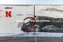 A red smear shows where one of the wheels left a mark on the barrier along with the rest of the tank