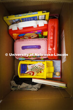 Ashton Koch, senior from Omaha and the outreach coordinator for the Women’s Center, sorts gifts fo