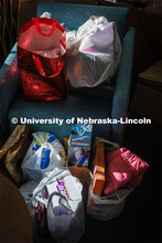 Ashton Koch, senior from Omaha and the outreach coordinator for the Women’s Center, sorts gifts fo