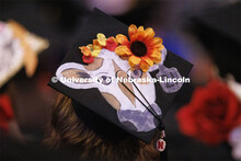 Decorated mortarboards at the Undergraduate Commencement at Pinnacle Bank Arena. December 18, 2021. 