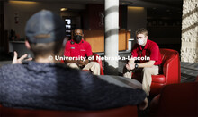 UNLPD Community Service Officers Komlan Akakpo and Trevor Caldwell talk with Cohan Bonow, student an