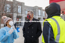 Chancellor Ronnie Green talks with COVID Testing Site Supervisor Myra Ferrara and William Barrera ou