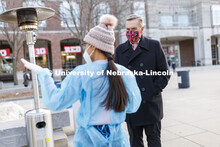 Chancellor Ronnie Green talks with COVID Testing Site Supervisor Myra Ferrara outside the Nebraska U