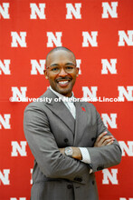 Marco Barker, Vice Chancellor, Diversity and Inclusion, poses in front of the Nebraska N backdrop at