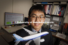 Jae Sung Park, poses with an airliner model. He is an NSF CAREER award winner and is researching a d