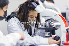 Huskers completing a microbiology and human health (BIOS 111) lab in Beadle Hall use microscopes to 