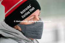 University of Nebraska Curling Club adviser Nancy Myers watches practice at the John Breslow Ice Hoc
