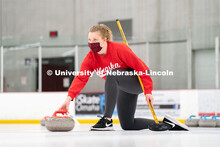 Olivia Schuster serves a curling stone during practice at the John Breslow Ice Hockey Center. Curlin