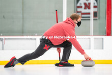 Luke Schroeder serves during curling practice at the John Breslow Ice Hockey Center. Curling Club. F