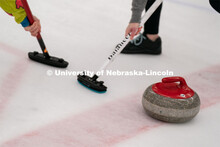A curling stone moves across the ice at the John Breslow Ice Hockey Center. Curling Club. February 1