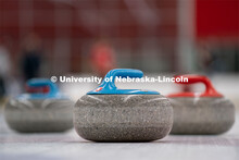 Three curling stones sit on the ice at the John Breslow Ice Hockey Center. Curling Club. February 1,