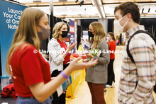 Recruiter Cassidy Starostka and Claire Fletcher talk at the Omaha National Insurance booth at the UN