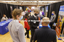 John Protopopov talks with recruiters at the UNL Spring Career Fair in the Nebraska Union. February 