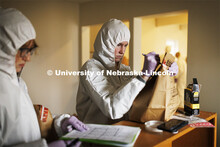 Mariah Kaup seals evidence into a bag so it can be analyzed. Students do crime scene investigation i