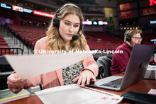 Hailey Ryerson organizes her notes before the Huskers’ Women’s Basketball match against Minnesot