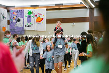 Miracle Family members who attend the marathon run through a cheering tunnel of students to start th