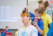 Students shave their hair to raise money. University of Nebraska–Lincoln students exceeded their g