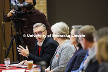 Chancellor Ronnie Green talks with the group as Executive Vice Chancellor Katherine Ankerson listens