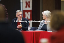 Chancellor Ronnie Green talks with the group as Executive Vice Chancellor Katherine Ankerson listens
