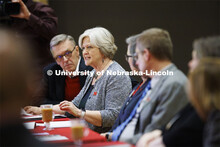 Executive Vice Chancellor Katherine Ankerson talks with the group as Chancellor Ronnie Green listens