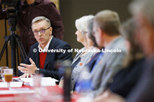 Chancellor Ronnie Green talks with the group as Executive Vice Chancellor Katherine Ankerson listens