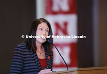 Shelley Zaborowski, Executive Director of Nebraska Alumni Association, talks with the group. Chancel