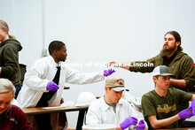 Students were encouraged to participate in the sausage-making process to further understand the less