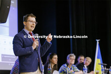 Lukasz Niparko, a graduate student in political science, talks with the audience. Stand With Ukraine