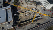 A construction crane fills the sky as work progresses on Kiewit Hall. March 2, 2022. 