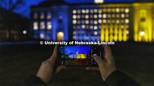 Melissa Wilkerson photographs Love Library on Nebraska’s City Campus. The library was illuminated 