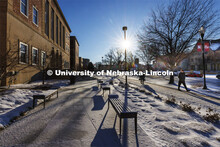 Benches on the south side of the Union are covered in a dusting of snow. Huskers woke up Monday morn