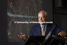 Jack Beard speaks about the use of commercial satellites in the Ukraine war. On the screen behind hi