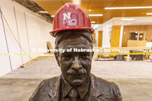 Roscoe Pound wears a hard hat in the entry of the Law Library. Law college photo shoot. Nebraska Law
