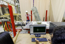 Mohammadreza Farooghi Mehr directs the positioning of a slab on a large shake table in Christine Wit