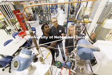 Aingaran Bala Raman, Ethan Yungdahl and Josiah Kolar examine a bioreactor in Hunter Flodman’s UO L