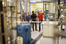 Hunter Flodman explains equipment in the UO Lab with students Ethan Yungdahl, Josiah Kolar and Ainga