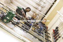 Aingaran Bala Raman, Ethan Yungdahl and Josiah Kolar examine equipment in Hunter Flodman’s UO Lab.
