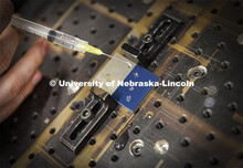 A laser treats the surface of titanium, so it repels water. The droplets roll off the surface in Cra