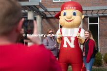 Students pose with Lil’ Red near the Van Brunt Visitor’s Center. Admitted Student Day is UNL’s