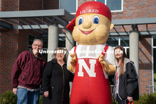 Students pose with Lil’ Red near the Van Brunt Visitor’s Center. Admitted Student Day is UNL’s