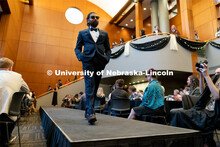 Students walk across the runway wearing designs from local independent retailers during the Global G