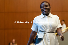 Students walk across the runway wearing designs from local independent retailers during the Global G