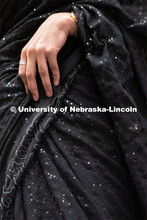 International students walk across the runway wearing cultural garments during the Global Glam fashi