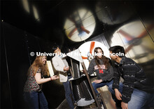 Wei Qiao demonstrates a wind turbine in the wind tunnel. College of Engineering photo shoot. March 3