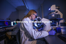 Students in Ryan Pedrigi and Ruiguo Yang’s lab work with microscopes, cell culture experimental eq