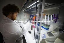 Students in Ryan Pedrigi and Ruiguo Yang’s lab work with microscopes, cell culture experimental eq
