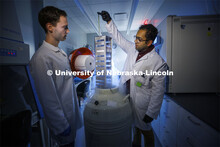 Students in Ryan Pedrigi and Ruiguo Yang’s lab work with microscopes, cell culture experimental eq